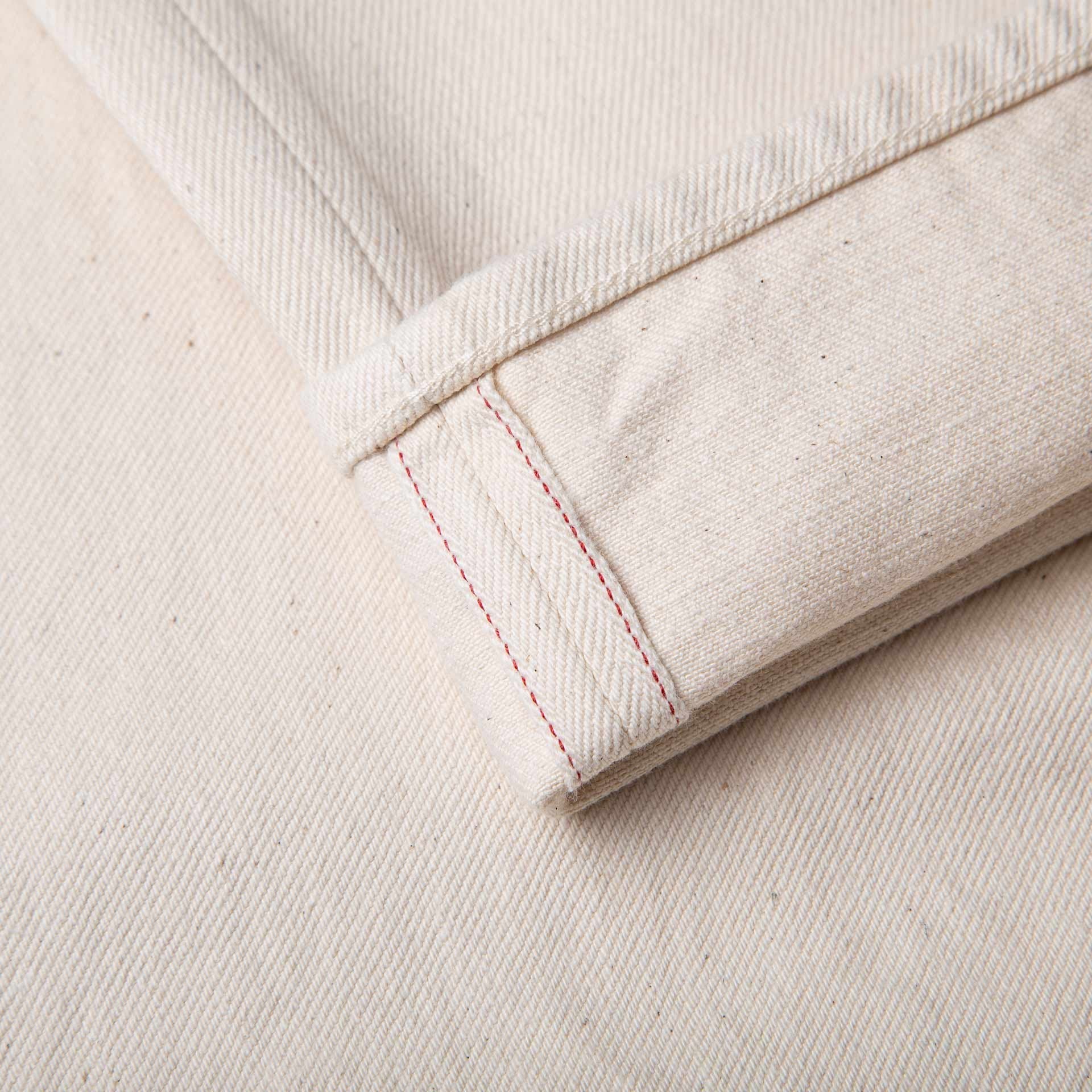 Ecru woven fabric ready for dyeing — undyed denim-adjacent fabric from Umed Group
